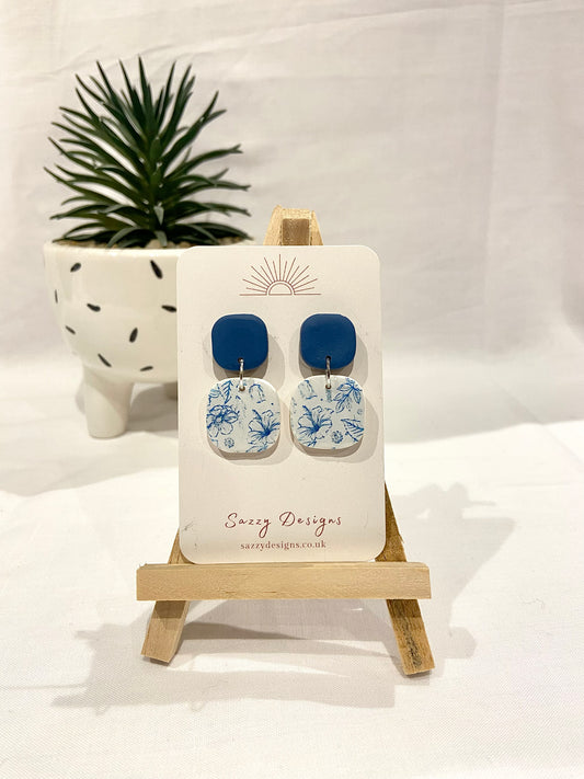 Blue and white flower patterned dangle earrings